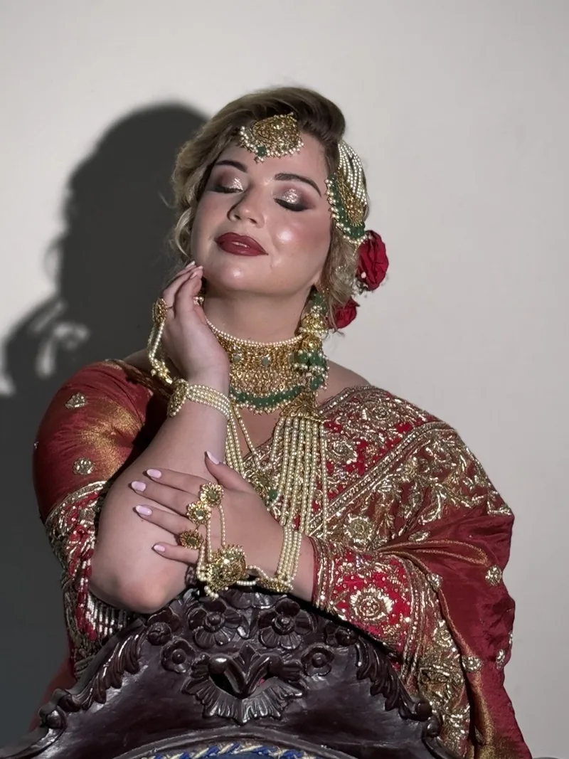 Contemporary bridal makeup and sculpted bridal hairstyle by Alina Khatoon and @hairstylisthyderabad