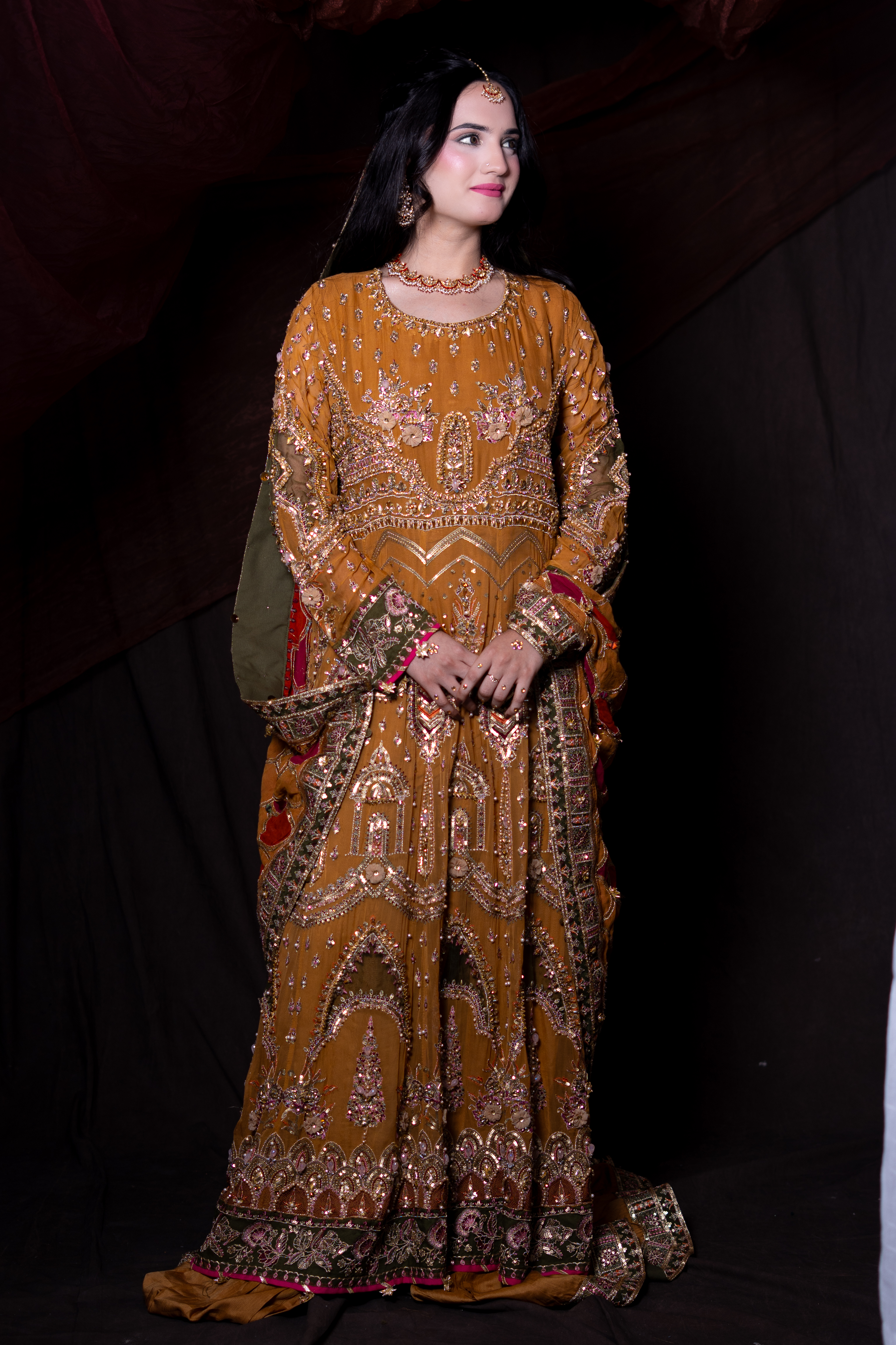 Regal bridal portrait featuring soft radiant complexion and ceremonial jewellery